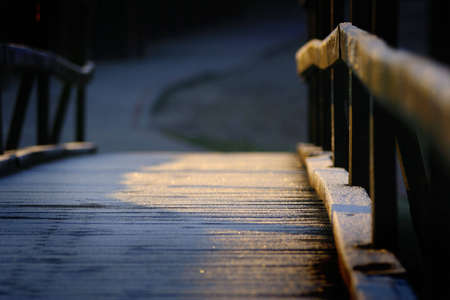 Small wooden bridge in the cold morningの写真素材
