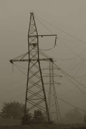 Pylons and mist in a cold cloudy day