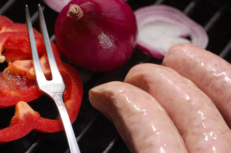White sausages on the grillの写真素材