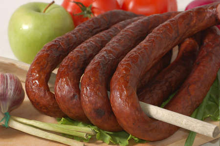 Sausage, apple and tomatoesの写真素材