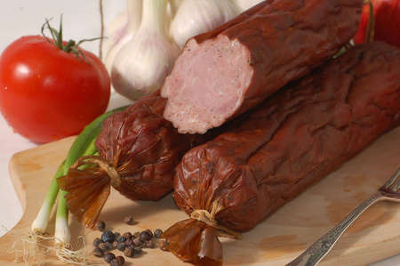 Baked sausage on the chopping boardの写真素材