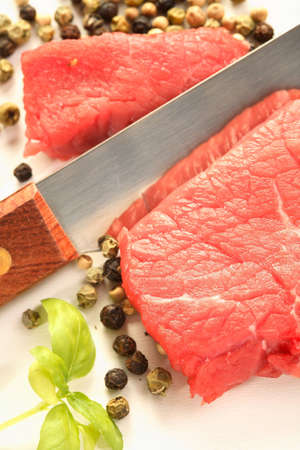 Meat, knife and pepperの写真素材