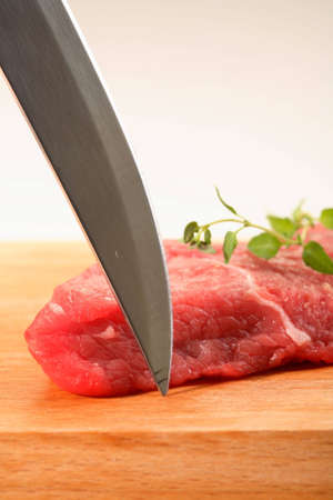 Meat, herbs and knifeの写真素材