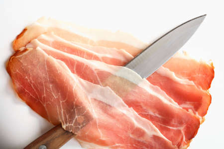 Knife and slices of hamの写真素材