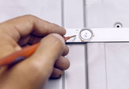 Technician repairing television led ,engineer measures the voltage on the led boardの写真素材