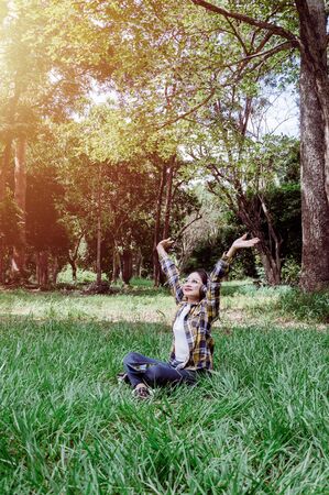 woman enjoying the music from her tablet in summer season. Outdoor lifestyleの写真素材
