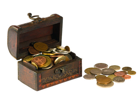 Wooden chest with coins on a white background
