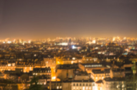 Paris cityscape at night, defocused bokeh background.の写真素材