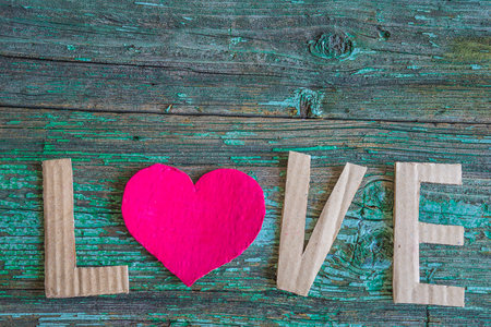 Word love and red heart on old wooden background. valentines day conceptの写真素材
