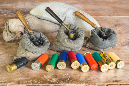 Hunting equipment and ammunition on a wooden background. selective focus.の写真素材