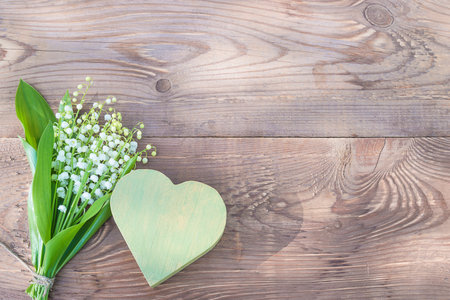 Lily of the valley on a wooden background. copyspace.の写真素材
