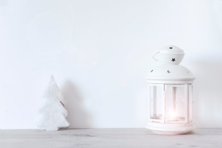 Christmas background with christmas tree and lantern on a white background.の写真素材