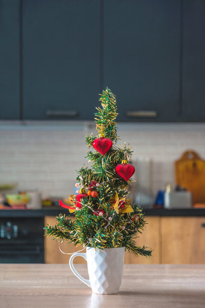 Christmas tree in the kitchen. Christmas and New Year holidays concept.の写真素材