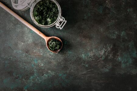 A glass with pesto on 
black background.  Top view. Free space for your text.の写真素材