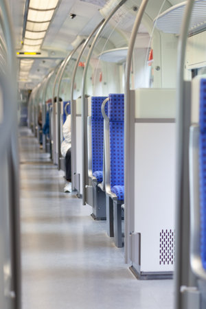 Center aisle and empty rows of seats in a bus