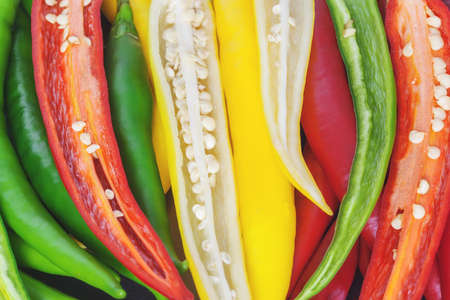 Closeup of chilli peppers with vibrant colors.
