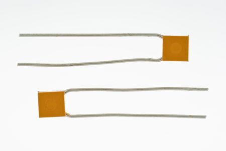 Pair of capacitors isolated on whitedの写真素材