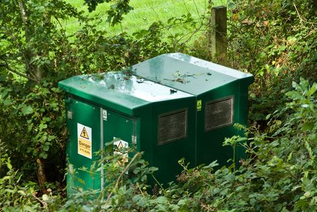High voltage transformer box in country environmentの写真素材