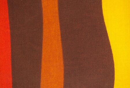 Patterned fabric in red, orange, yellow and brownの写真素材