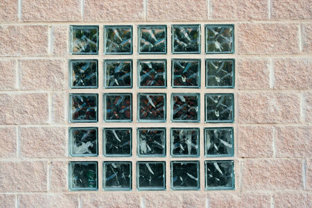 Glass block window built into a brick wall