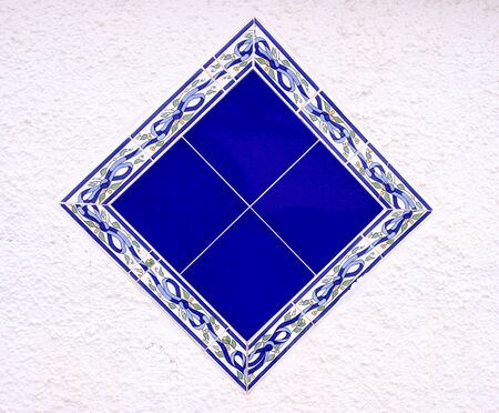 decorative aquare pattern on a Spanish wall