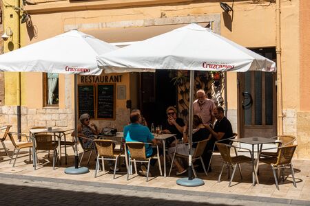 Denia, Valenciana, Spain - Sept 23 2019 : Restaurant in streets of Denia with locals enjoying a drinkのeditorial素材