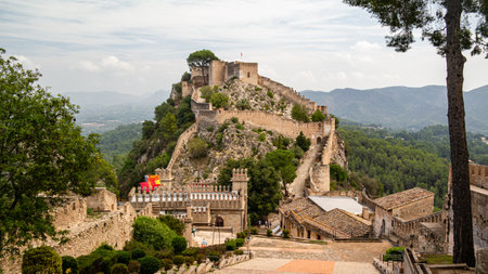 Xativa, Valenciana, Spain - Sept 17 2019 : View of Xativa small castle from walls of larger castle with tourists wandering around.のeditorial素材