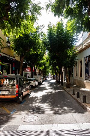 Denia, Valenciana, Spain - Sept 23 2019 : streets of Denia with tourists wandering around.のeditorial素材