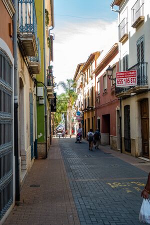 Denia, Valenciana, Spain - Sept 23 2019 : streets of Denia with tourists wandering around.のeditorial素材
