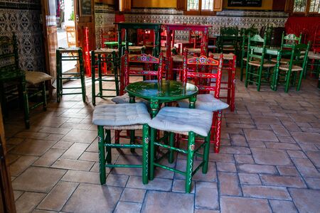 Hand painted tables and chairs in a Spanish bar.の写真素材