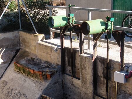 Sluice gate motors for controlling water flow from aquaductの写真素材