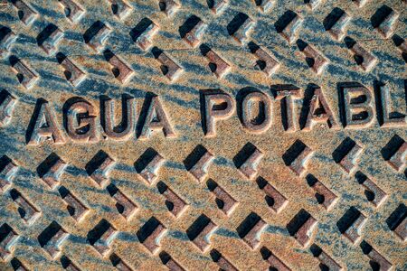 a water manhole cover on spanish urbanisationの写真素材