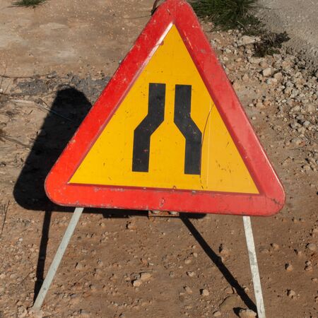 spanish warning road sign for road narrowsの写真素材