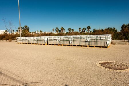 paving slabs stacked at roadside ready for useの写真素材
