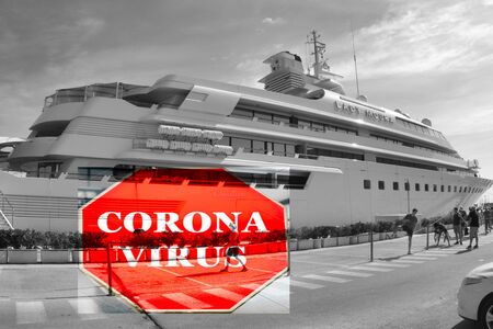 Large cruise ship at port with sign indicating warning of Coronavirus - infectious disease concept