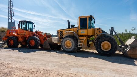 Torrevieja, Valenciana, Spain - Feb 26 2020 : heavy weight diggers parked in spanish urbanisationのeditorial素材