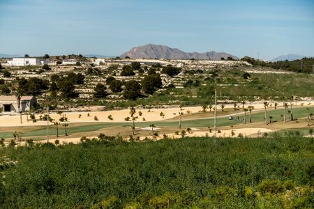 view over golf course with spanish mountains in the backgroundの写真素材
