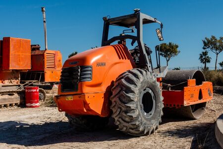 Torrevieja, Valenciana, Spain - Feb 27 2020 : heavy weight road roller parked in spanish urbanisationのeditorial素材