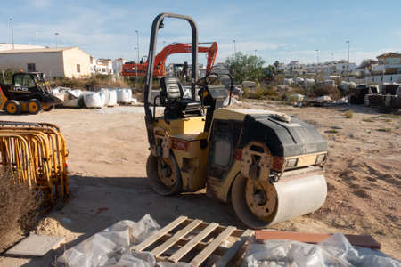 Torrevieja, Valenciana, Spain - May 02 2020 : small road rolle in builders yard on urbanisation in spainのeditorial素材