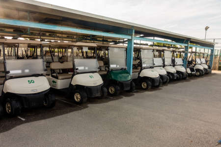 Torrevieja, Valenciana, Spain - May 04 2020 : row of golf buggies on golf course in spain, idle due to covid-19 lock downのeditorial素材