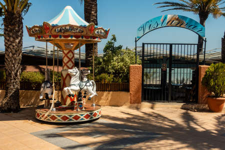 Torre de la Horadada, Valenciana, Spain - June 03 2020 : childrens roundabout outside Vistamar restaurantのeditorial素材