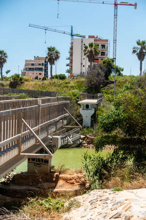 Mil Palmeras, Valenciana, Spain - June 03 2020 : Bridge over river destroyed by recent heavy rain storms and floodsのeditorial素材