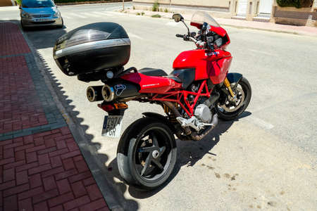 Torrevieja, Valenciana, Spain - June 07 2020 : Ducati Multistrada 1100 S motorbike, in Red, parked in streetのeditorial素材