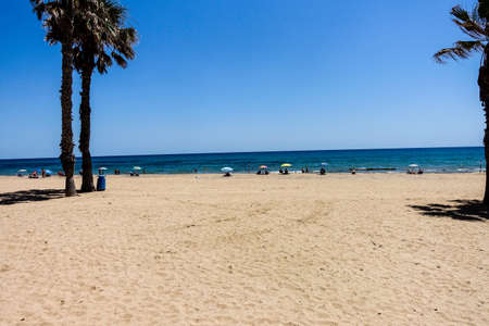 La Mata, Valenciana, Spain - June 22 2020 : Beach and town during covid distancingのeditorial素材