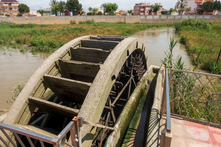 Water Wheel pump used to provide water for Orchard irrigationの写真素材