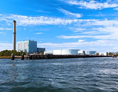Power station situated on the coastline by the oceanのeditorial素材