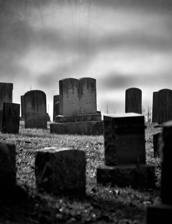 Very old misty and creepy graveyard in black and white のeditorial素材
