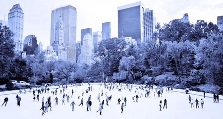 Ice skaters having fun in New York Central Park in fall
