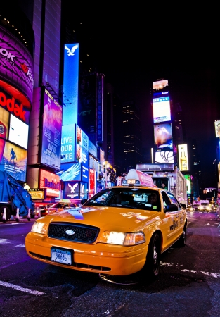 NEW YORK CITY - DEC 28: Times Square ,is a busy tourist intersection of neon art and commerce and is an iconic street of New York City and America, December 28th, 2011 in Manhattan, New York City.のeditorial素材