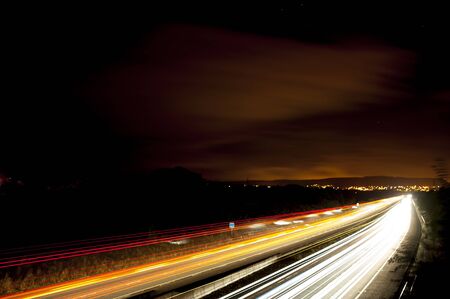 A nighttime long exposure of the busy traffic M5 motorway between Gloucester and Bristol